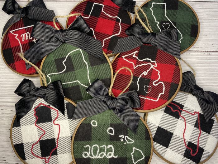 Plaid hoop ornaments with embroidered state outlines and hearts