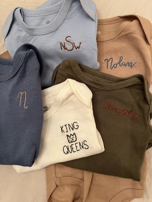 Baby onesies embroidered with names and monograms