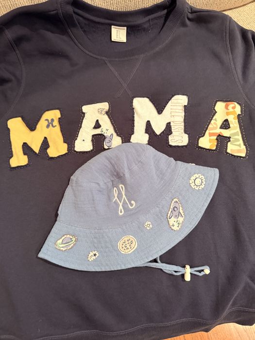 Navy tee with MAMA in chainstitch and a bucket hat with small embroidered charms