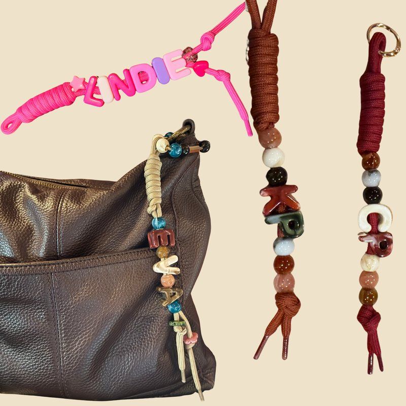 Chunky letter bead name keychains made with chunky alphabet beads on pink, rust, wine and tan paracord