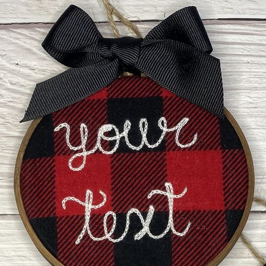 Red buffalo check hoop ornament chain-stitched with the words your text in white script